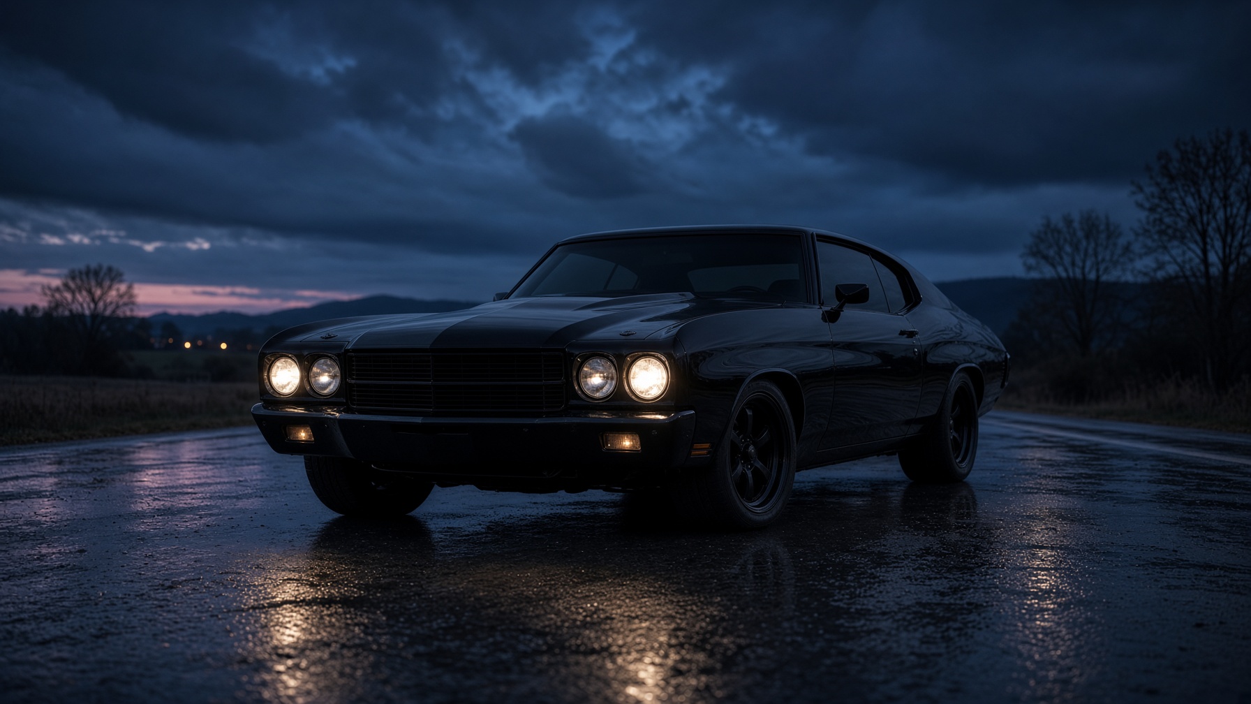 Black 1970 Chevelle on a wet Eastern Ontario highway at dusk